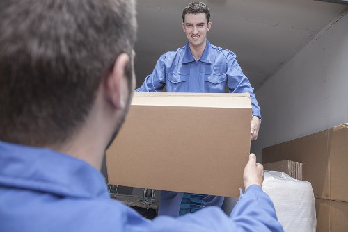 Removal team planning a home move in Spain with boxes and furniture