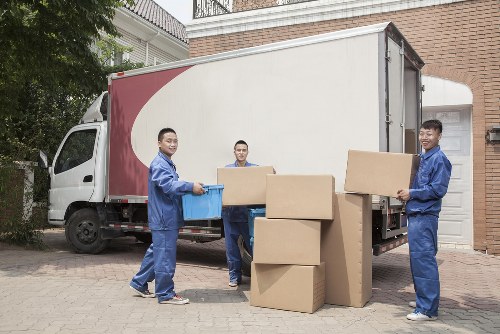 Removal team handling home moving boxes in Spain