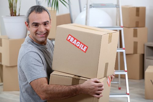 Professional movers planning a relocation in Spain with apartment access in mind