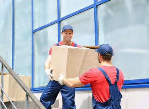Moving team organising items for transport