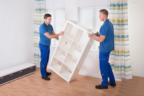 Team removing bulky furniture from a Spanish apartment