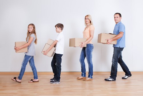 Careful packing of fragile household items before a move in Spain
