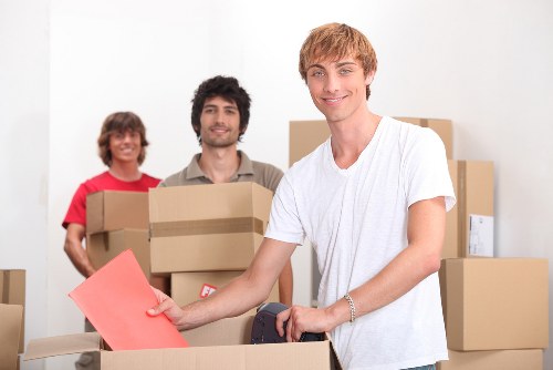 Local movers navigating narrow streets and parking in a Spanish town
